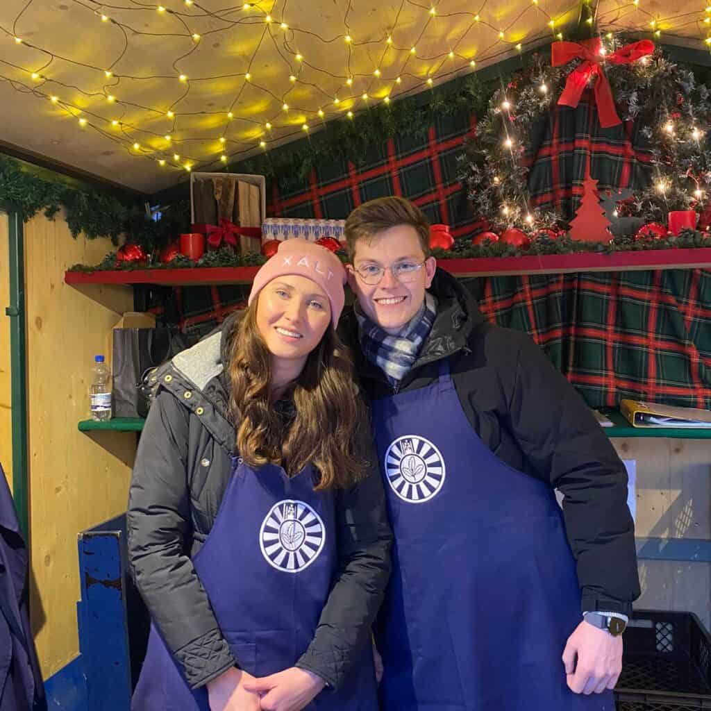 Julia and Jan support the mulled wine stand at the Leipzig Christmas market